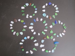 7 × 13 pieces of beach glass found on the shore of Lake Michigan and arranged on my coffee table.